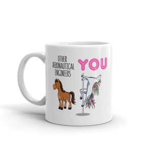 May include: White ceramic mug with a pink "YOU" and a unicorn on a pole. The text "OTHER AERONAUTICAL ENGINEERS" and a brown horse are on the left side of the mug.
