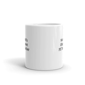 May include: White ceramic coffee mug with black text that reads "World's Okayest PE Teacher" on the right side and "World's Okayest Teacher" on the left side.