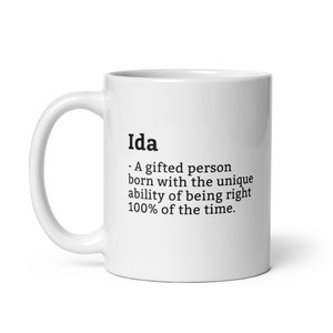 May include: White ceramic coffee mug with a black text design that reads "Ida - A gifted person born with the unique ability of being right 100% of the time."