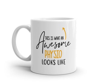 May include: White ceramic mug with a black and gold design. The mug says "This is what an awesome physio looks like" with an upward arrow.