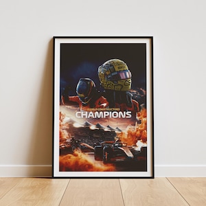 May include: A framed poster with a black background featuring two race car drivers wearing helmets. The drivers are standing in front of a race track with a sunset in the background. The text "WORLD CONSTRUCTORS CHAMPIONS" is printed in white on the poster.