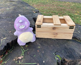 Little Purple Monster, 6". Handmade cedar crate, with antique brass hinges and clasp, is included.