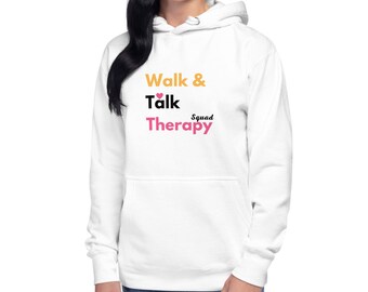 Puede incluir: Sudadera con capucha blanca con el texto "Walk & Talk Squad Therapy" en naranja, negro y rosa.