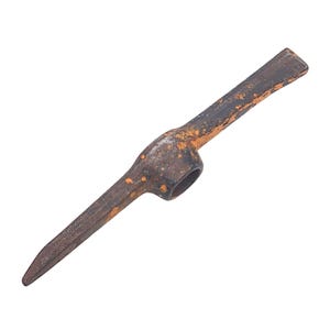 May include: A vintage pickaxe with a pointed end and a flat, chisel-like edge. The metal tool shows signs of rust and wear, with a dark brown and orange color scheme. The pickaxe features a circular opening for a handle.