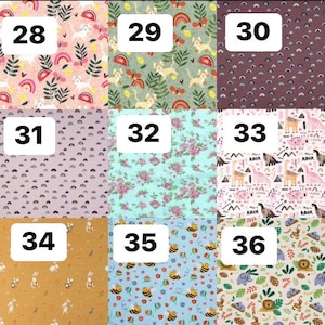 Pode incluir: Uma cole&ccedil;&atilde;o de amostras de tecido, cada uma com um padr&atilde;o &uacute;nico. Os designs incluem arco-&iacute;ris, gatos, dinossauros, abelhas e arranjos florais. As amostras est&atilde;o numeradas de 28 a 36, oferecendo uma variedade de cores e temas.