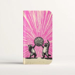 May include: Two raccoons wearing party hats hold up a disco ball against a pink and white background with a sunburst pattern.