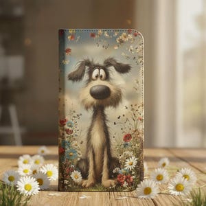 May include: A phone case featuring a cartoon dog sitting in a field of flowers. The dog has a large nose and expressive eyes. The background is a soft blue sky with more flowers. Daisies are scattered on the wooden surface.