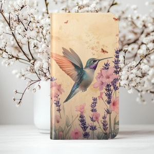 May include: A hummingbird with iridescent green and purple feathers flies over a field of lavender and pink flowers. The background is a vintage-style cream color.