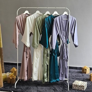 Bridesmaid robes long ankle length in hues of blues, sage and emerald. Calf length silk personalized robes in plus size for bridal party.