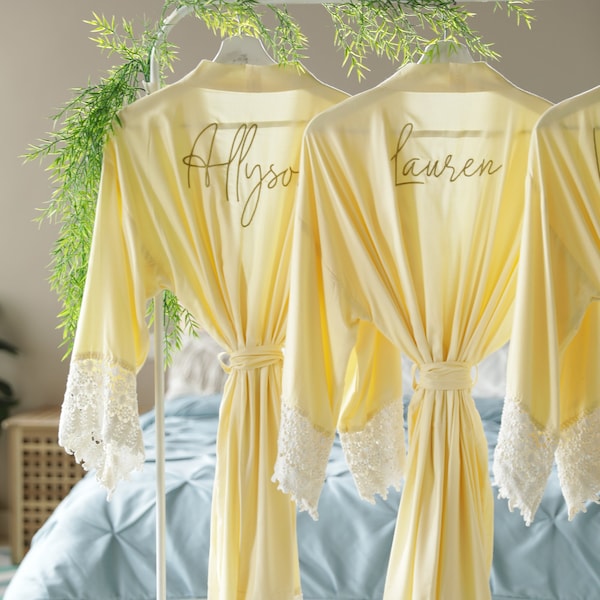 Bridesmaid robes personalized with names, maid of honor, matron of honor, mother of the bride and groom in light yellow.