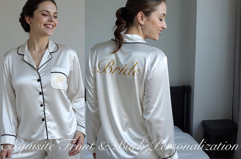 A woman models a white satin pajama set with black piping, featuring elegant front and back personalization. The front pocket is customized with the name “Liz” in gold script, while the back showcases the word “Bride” in large gold lettering. The pajamas have a classic button-down style and a luxurious sheen, perfect for bridal parties or personalized wedding morning outfits. The image highlights the exquisite detailing and customization options available.