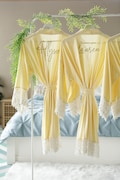 Bridesmaid robes personalized with names, maid of honor, matron of honor, mother of the bride and groom in light yellow. product logo