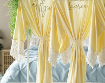 Bridesmaid robes personalized with names, maid of honor, matron of honor, mother of the bride and groom in light yellow.