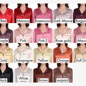 Color chart displaying 20 satin pajama tops worn by models, labeled: Red, Maroon, Rosewood, Dark Mauve, Burgundy, Purple, Pink, Pink-2, Rose Gold, Mauve, Gold, Champagne, Yellow, Orange, Dull Gold, Black, White (ivory), Brown, and Leopard. Each top features contrast piping and button-down front.