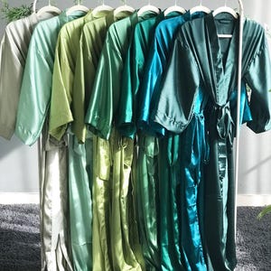 Bridesmaid robes in Deep Emerald green silk satin with ankle or calf length options long personalized robes with pockets and liner add ons.