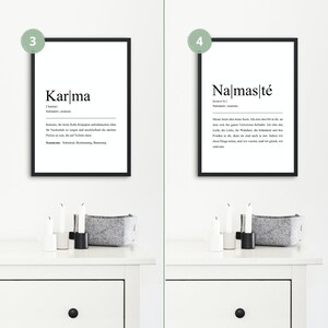 May include: Two black framed prints with white text on a white background. The print on the left says "Karma" and the print on the right says "Namaste".