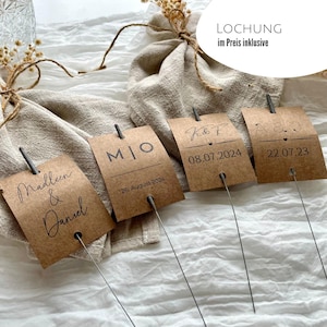 Romantische Hochzeitsdeko aus Kraftpapier, eine Vintage Deko für den Hochzeitstanz mit Knicklichtern, ergänzt durch personalisierte Kärtchen