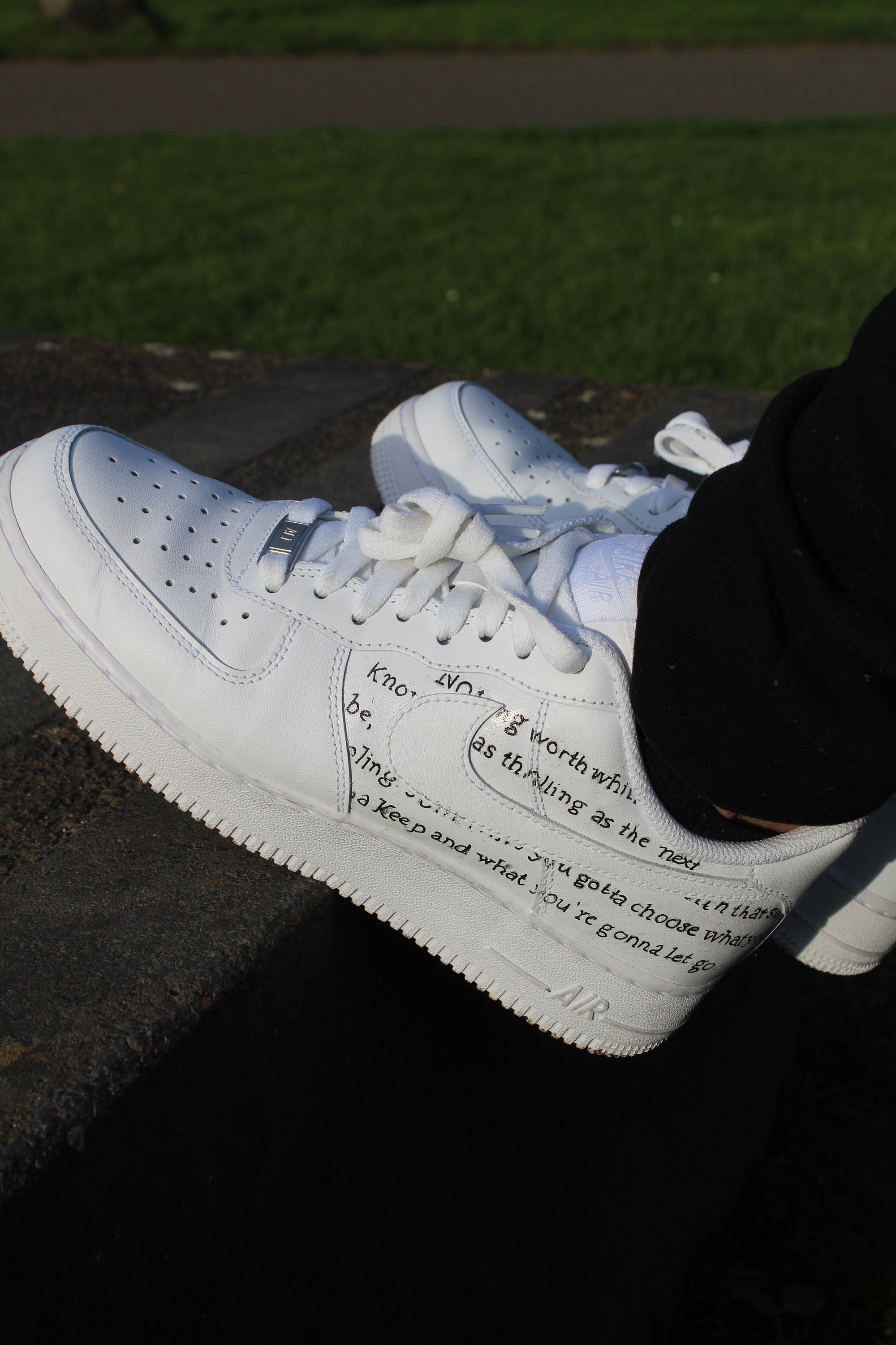 air force ones with words on them