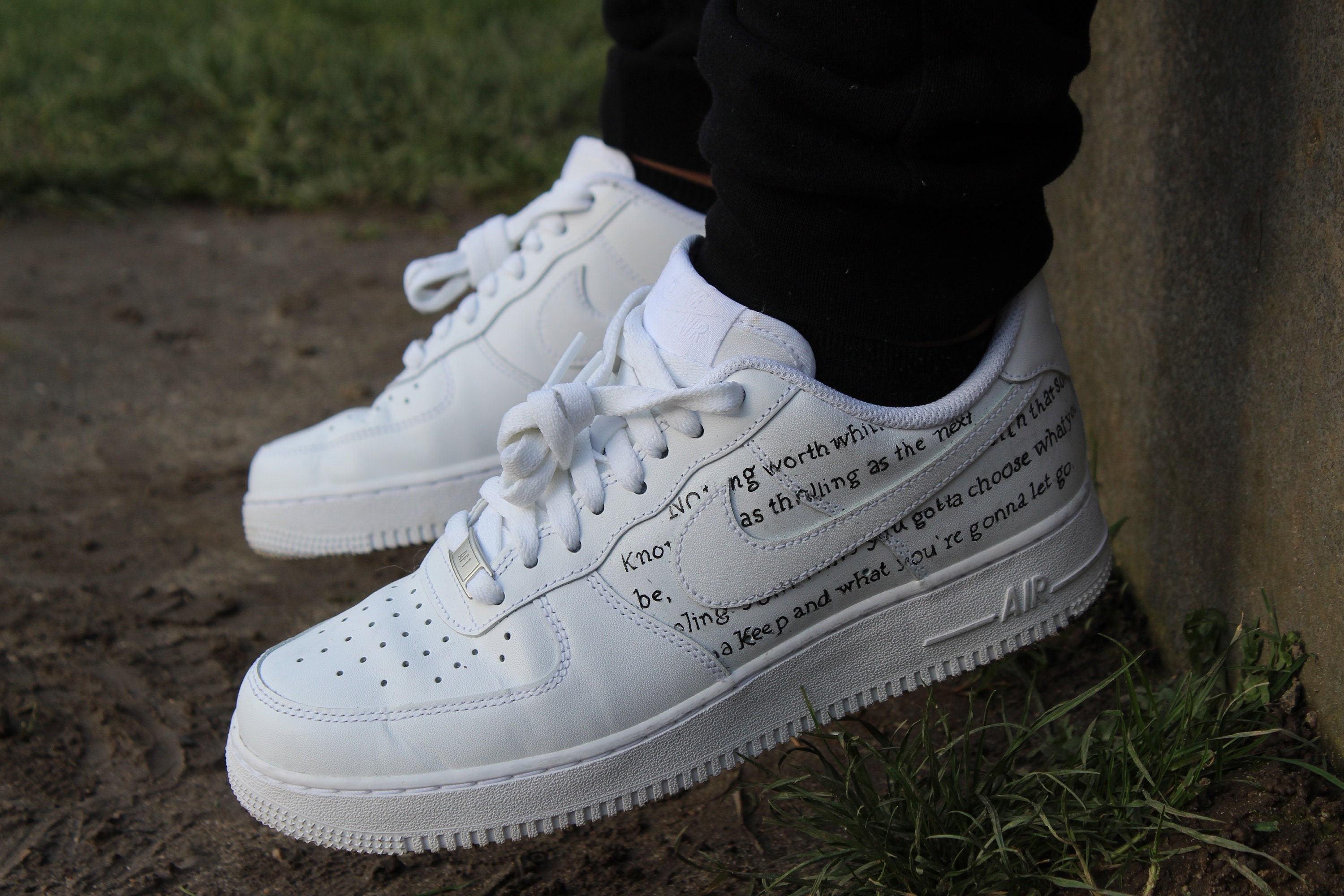 air force ones with words on them