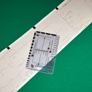 May include: A clear plastic ruler with markings for measuring heart rate, PR, QRS, QT, and ST intervals. The ruler is labeled "Star-resources" and "For educational purposes only 2024".