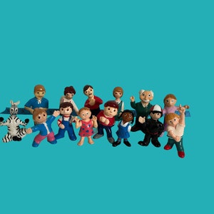 Puppet figurines from the children's television program Passe-Partout, featuring the family and friends of Cannelle and Pruneau, set of 14
