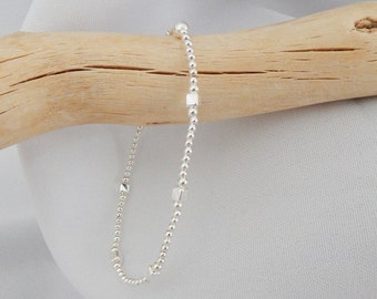 Thin elastic bracelet with cubes and 925 silver beads