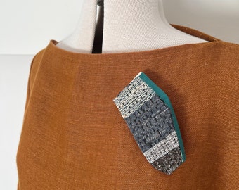 Statement wood and handwoven textile brooch | blues and greys | woven in linen, hemp, wool, tape and horsehair | hand painted balsa wood