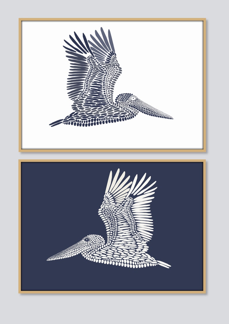 May include: Two framed prints of a stylized pelican made of dots. The pelican is in flight with its wings spread. The top print has a white background and the pelican is navy blue. The bottom print has a navy blue background and the pelican is white.