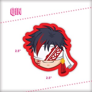May include: A red and white cartoon character with black hair and a white eye patch. The character is wearing a red and white headband with a gold tassel. The character is 2.5 inches tall and wide. The character's name is Qin.