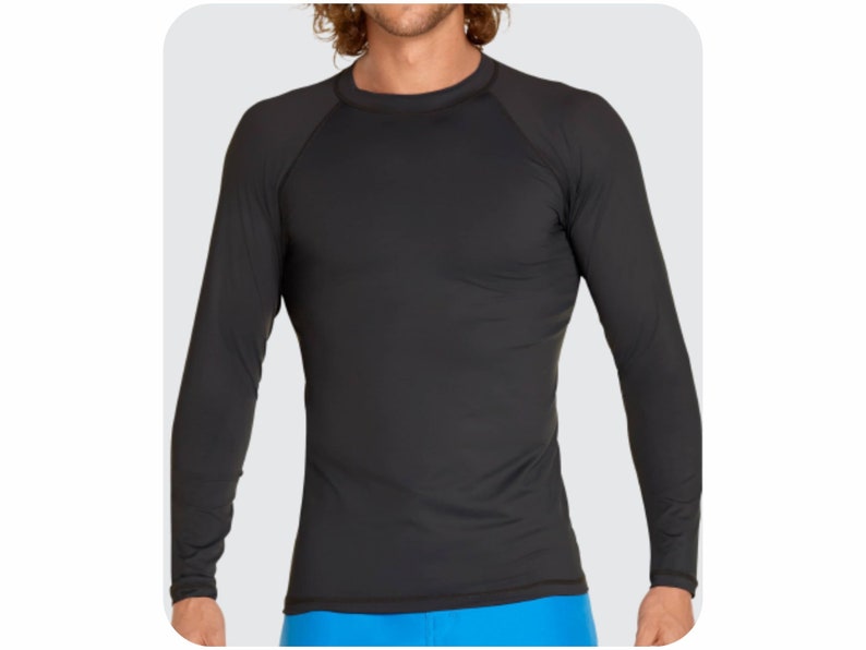 May include: Black long-sleeve shirt with a crew neck and raglan sleeves.