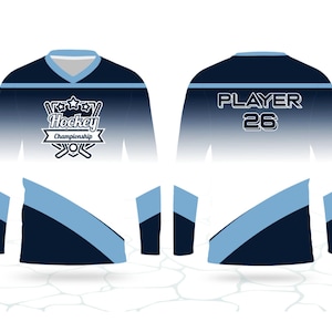 May include: A long-sleeved hockey jersey in white, navy blue, and light blue. The front has "Hockey Championship" and crossed hockey sticks. The back shows "PLAYER 26". A sports-themed garment.