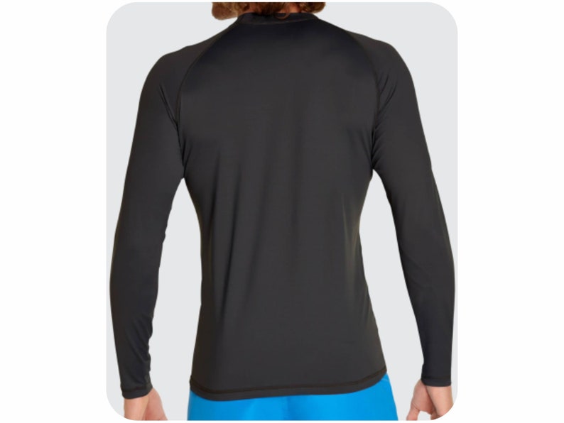 May include: Black long-sleeve rash guard shirt with a crew neck.