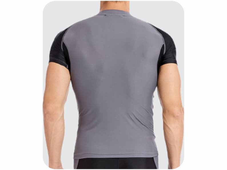 May include: A gray short-sleeved shirt with black accents on the sleeves. The shirt is made of a smooth, athletic material.