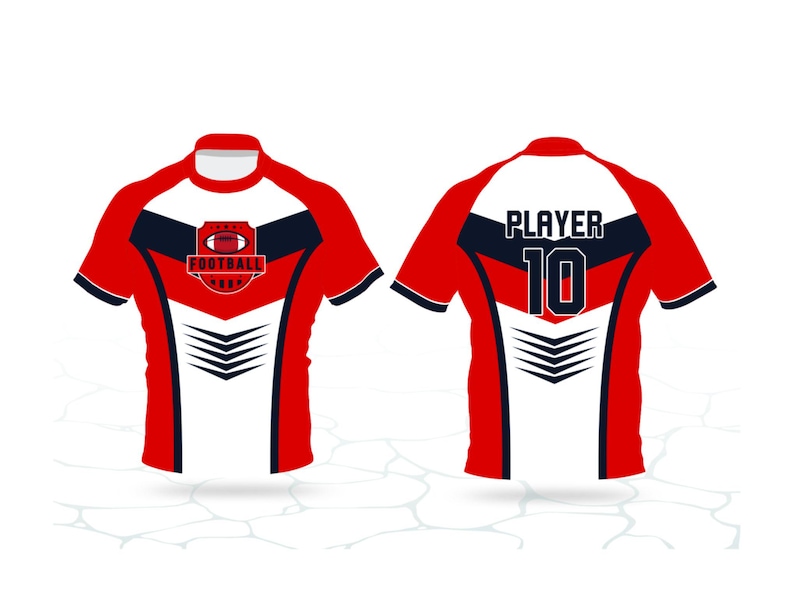 以下が含まれることがあります： 赤、白、ネイビーブルーのアメリカンフットボールのジャージ。前面にはフットボールのグラフィックと「FOOTBALL」の文字があります。背面には「PLAYER」と数字の「10」が表示されています。