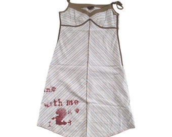 May include: A striped, sleeveless dress with a brown trim and a red graphic that says "time with me".