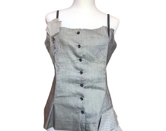 May include: A gray sleeveless top with a button-up front and a striped fabric detail at the bottom.