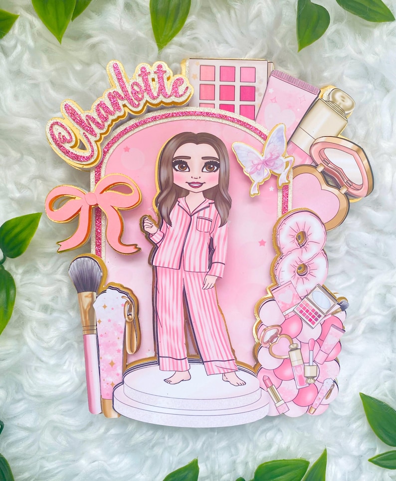 Personalized makeup-themed cake topper featuring a girl in pink striped pajamas surrounded by beauty and spa accessories including makeup brushes, lipstick, blusher, eyeshadow, skincare items, and a pink bow. The topper is decorated in pink glitter card and gold mirror  with the name and age of the birthday girl, making it perfect for a glam birthday, spa party, or makeup-themed celebration.
