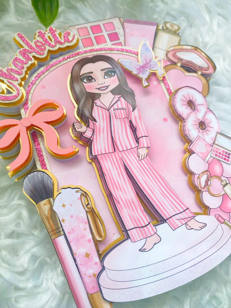 Personalized makeup-themed cake topper featuring a girl in pink striped pajamas surrounded by beauty and spa accessories including makeup brushes, lipstick, blusher, eyeshadow, skincare items, and a pink bow. The topper is decorated in pink glitter card and gold mirror  with the name and age of the birthday girl, making it perfect for a glam birthday, spa party, or makeup-themed celebration.