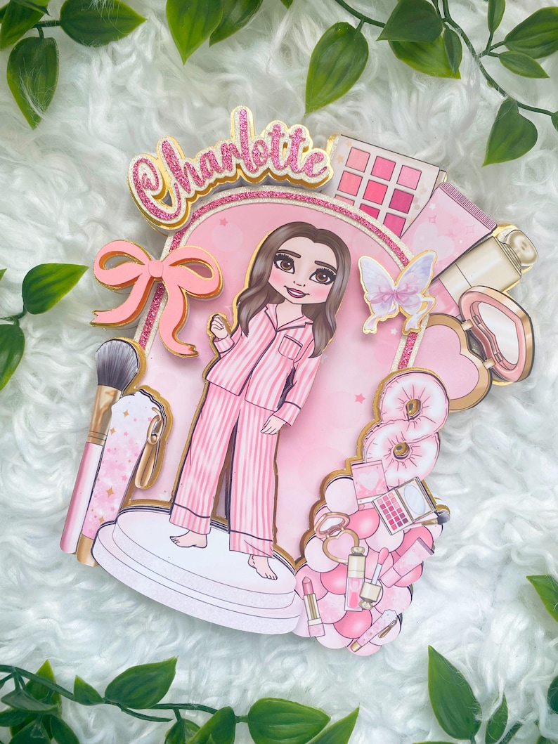 Personalized makeup-themed cake topper featuring a girl in pink striped pajamas surrounded by beauty and spa accessories including makeup brushes, lipstick, blusher, eyeshadow, skincare items, and a pink bow. The topper is decorated in pink glitter card and gold mirror  with the name and age of the birthday girl, making it perfect for a glam birthday, spa party, or makeup-themed celebration.