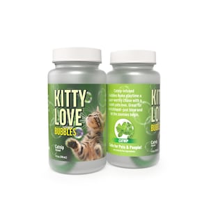 May include: Two clear plastic bottles of Kitty Love Bubbles with white screw-on caps. The labels feature a brown tabby kitten, green catnip leaves, and text stating Catnip-infused, 4 fl. oz. (118 mL), and Safe for Pets & People.