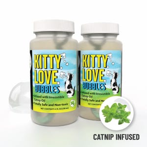 May include: Two bottles of "Kitty Love Bubbles" cat toy. The labels feature a playful design with a black and white cat illustration, bubbles, and the text "Catnip Infused". Each bottle contains 4 fl oz (118 mL).