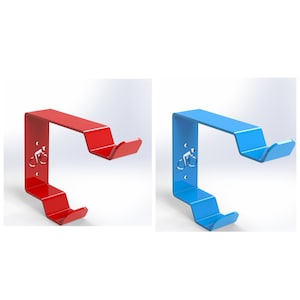 May include: Two bike hooks, one red and one blue, with a bicycle silhouette design. The hooks are made of metal and have a curved shape.
