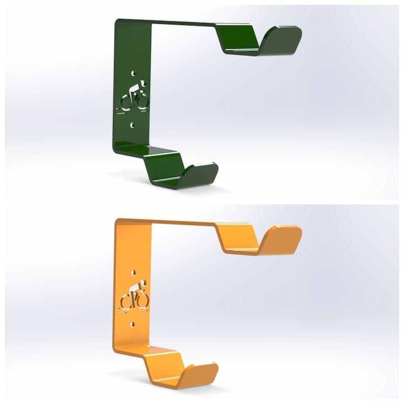 May include: Two bike hooks, one green and one orange, with a stylized bicycle silhouette cutout. The hooks are designed to be mounted on a wall.