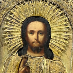 Antique brass icon Savior Jesus Christ. Orthodox old oil icon, faces of saints.