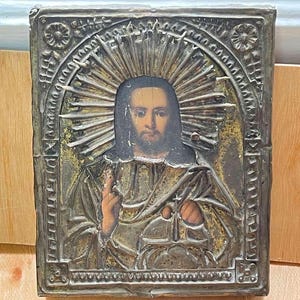 Antique icon Savior Jesus Christ. Orthodox old brass oil icon,  faces of saints.