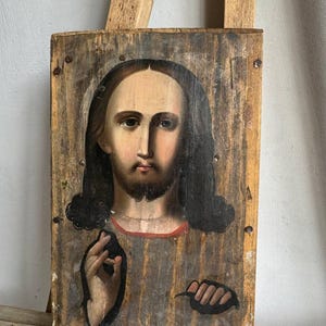 Antique small wooden Orthodox icon Jesus Christ Savior. Antique icon God Savior Jesus Christ. Orthodox old faces of saints.