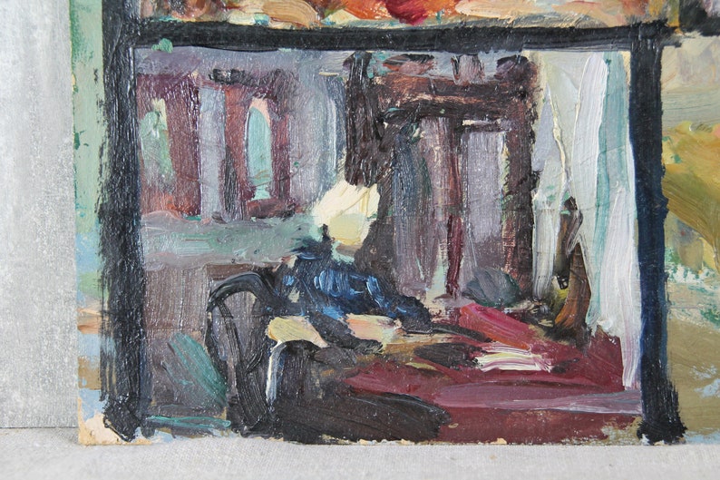 May include: A painting of a room interior with a black frame. The room is painted in shades of gray, blue, and red. There are two windows in the back wall, and a large piece of furniture in the foreground.