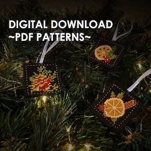 May include: Three digital cross-stitch patterns for Christmas ornaments. The patterns feature a pine cone, a cinnamon stick and orange slice, and an orange slice with holly.