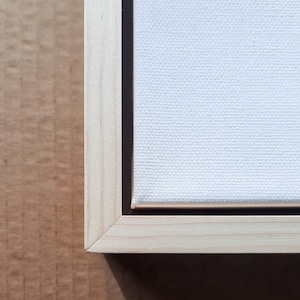 Corner of canvas floating frame.