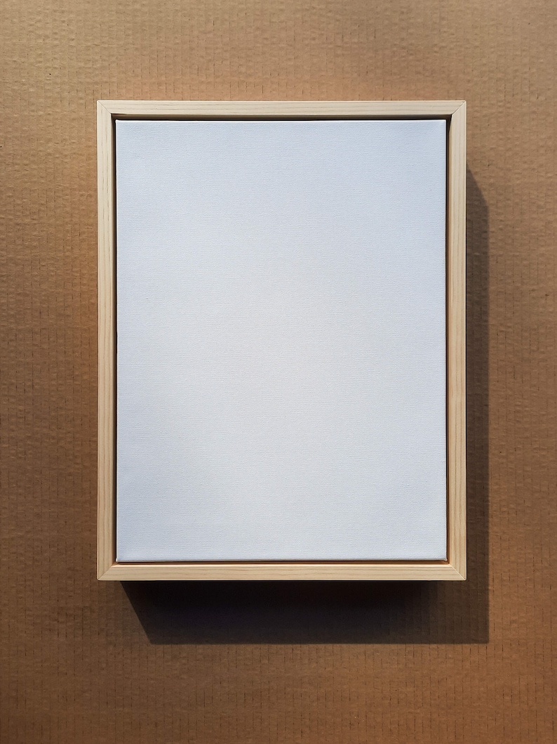 Framed 1.5" thick canvas in a pine canvas floating frame.